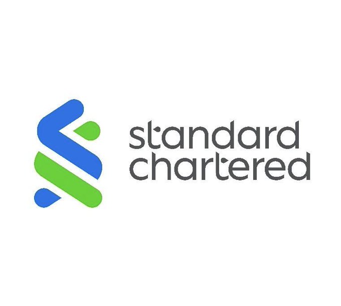 The official logo of Standard Chartered bank, featuring their distinctive blue and green intertwined design mark next to the company name in dark gray text.