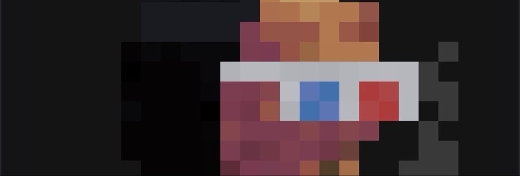 A heavily pixelated/blurred image of a small character with reddish-brown coloring and a white face featuring blue and red eyes.