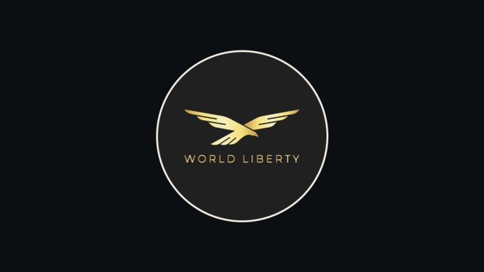 The image features the World Liberty Financial logo—an eagle emblem above the text "WORLD LIBERTY" enclosed in a circular border against a black background—tying into the announcement of the company's conditional OCC approval for a U.S. national trust bank charter to support its USD1 stablecoin operations.