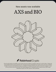 The image features a circular design with various shapes, including squares, triangles, and circles, all arranged around a central point. This design can be interpreted as a representation of the cryptocurrency market or Bitcoin, which has been gaining popularity over time. The text in the image reads "AXS and BIO", indicating that these are new assets available for trading on Robinhood Cryptocurrency.