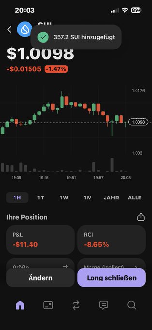 The image shows an iPhone screen displaying a cryptocurrency trading app, specifically showing a graph of Bitcoin and ethereum prices over time with their current values shown in US dollars. The phone appears to be turned off or not charged, as its display is blank.