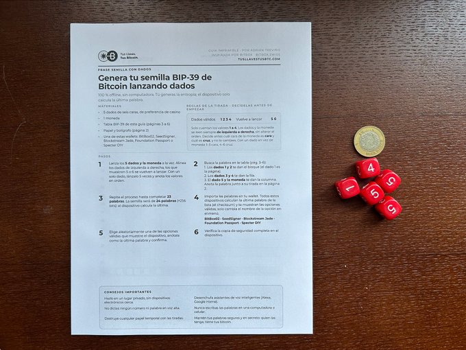 A Spanish-language guide titled "Genera tu semilla BIP-39 de Bitcoin lanzando dados" (Generate your BIP-39 Bitcoin seed by rolling dice) sits next to five red dice, illustrating the instructions for creating a 24-word cryptocurrency seed phrase using dice rolls. The printable PDF includes step-by-step directions and is compatible with hardware wallets like BitBox, Seedsigner, Jade, Passport, and Specter DIY.