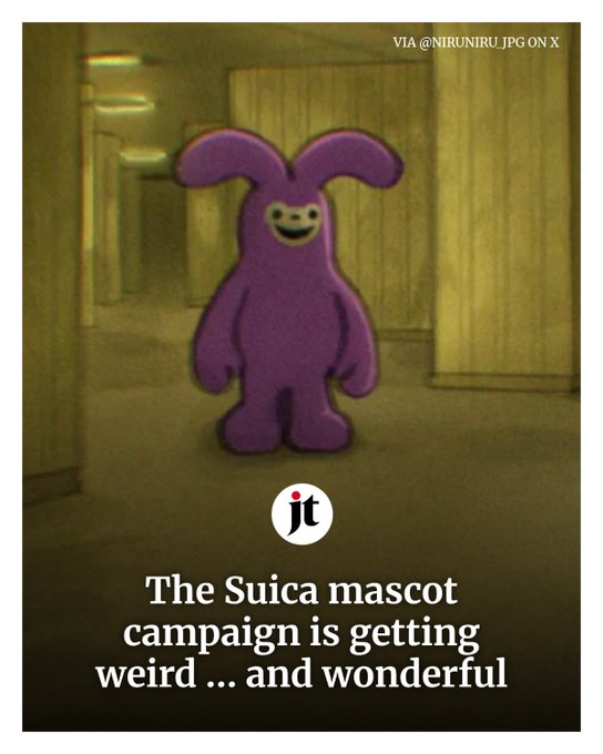 A purple rabbit mascot (resembling a Pengu-like character) stands in a dimly lit hallway with a wide smile, overlaid with Japan Times branding and the caption "The Suica mascot campaign is getting weird ... and wonderful." The image connects to the post by showing the viral Japanese rabbit character that's currently trending on Japan Twitter, referenced alongside the ticker $うさぎ and token contract 0x113d68c8cca4fe5ba25f49c00784079d168e7777.