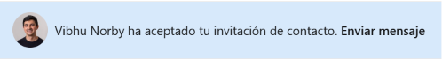 A notification message in Spanish stating 'Vibhu Norby ha aceptado tu invitación de contacto. Enviar mensaje' alongside a profile photo of a smiling man.