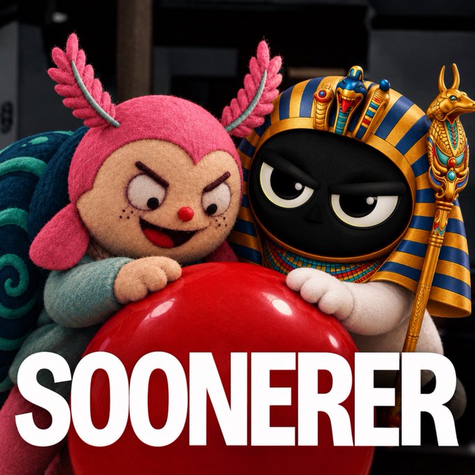 A 3D-rendered promotional image featuring two plush mascot characters—one pink axolotl-like creature and one Egyptian pharaoh-themed figure in gold and blue—holding a large red ball above the bold white text 'SOONERER'.