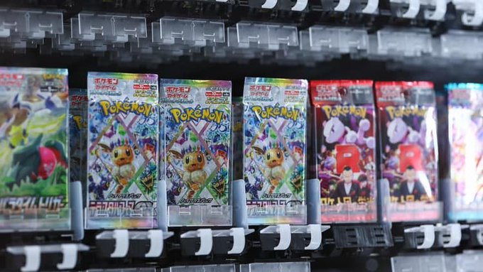 A retail display shelf showing Japanese Pokémon Trading Card Game booster packs, including several 'Pokémon Card 151' sets and what appears to be a 'Pokémon Card 151' set featuring Mew.
