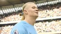 The image shows a blonde, chiseled-jaw man (the "Gigachad" meme figure) in a light blue jersey on a football pitch, used as the profile picture referenced in the post about the MonkeyHood NFT collection launching on the Robinhood chain.