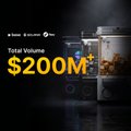 A promotional graphic celebrating Beezie's $200M total volume milestone, featuring a stylized vault illustration alongside bold yellow "$200M*" text against a dark background, complementing the post's quote from cofounder Andrea Miele highlighting Beezie's role as a marketplace, logistics player, and vault provider.