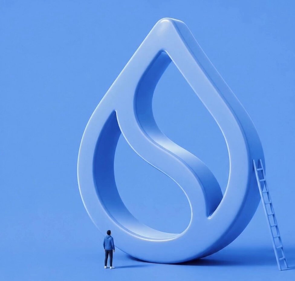 The image features a person standing near a large blue 3D-rendered water droplet that appears to be floating in midair or hovering above them. The person seems to be looking up at the droplet, possibly admiring its size or contemplating its significance. The scene is set against a solid blue background, which further emphasizes the prominence of the water droplet and the viewer's attention towards it.