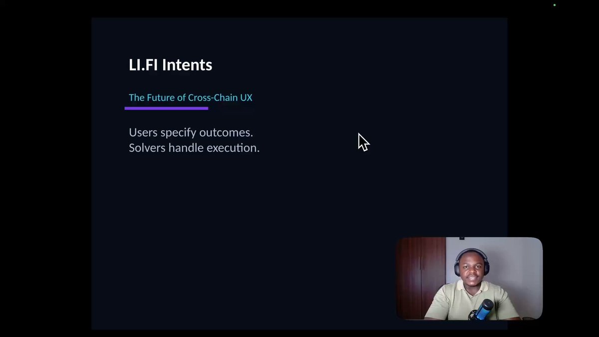 The image shows a man sitting at a computer, watching a video or screencast of a presentation titled "LFI Intent" by a person named "Solving CRISES WITH LIFI intent". The man appears to be actively engaged with the content being presented on the screen.