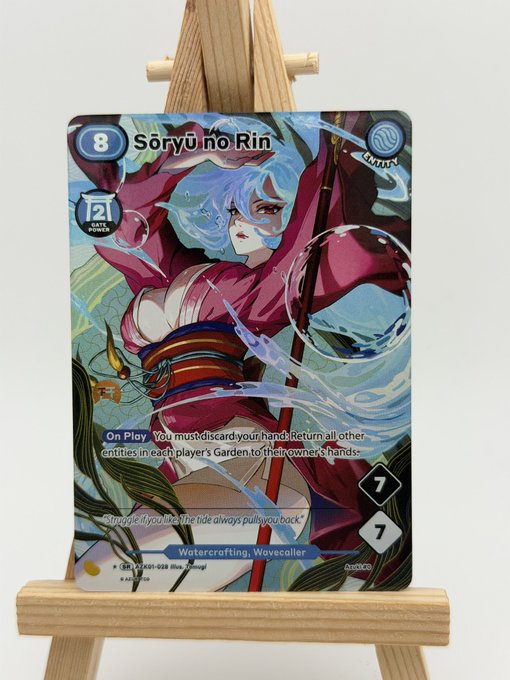 A trading card displayed on a wooden easel featuring "Sōryū no Rin" from Sorcery, with stats showing 8, 21 Slate Points, 7/7, and ability text for Watercrafting and Wavecaller.