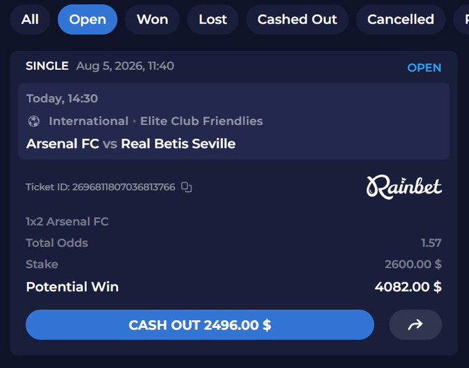 The image shows a sports betting ticket from Rainbet for an Arsenal FC vs Real Betis Seville friendly match (Elite Club Friendlies, International), placed on August 5, 2026, with a $2,600 stake at 1.57 total odds for a potential win of $4,082 and a current cash out offer of $2,496. This relates to the post by showing the user actively betting on a preseason soccer friendly while trading memecoins, capturing their excitement as the new football season approaches.