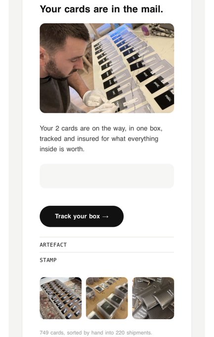 An email titled "Your cards are in the mail" shows a man in gloves carefully sorting cards into boxes, with text confirming "Your 2 cards are on the way, in one box, tracked and insured," a "Track your box →" button, and details noting "749 cards, sorted by hand into 220 shipments." The image exemplifies @jackbutcher's "Economy of words" by using minimal, purposeful copy to communicate trust and value—every phrase ("on the way," "tracked and insured") efficiently reinforces the brand's craftsmanship.