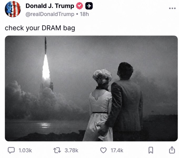 The image features a man and woman standing next to each other, looking up at a rocket launch. The caption of the image reads "check your DRAM bag", which seems to be a reference to Donald Trump's Twitter account. The photo is in black and white, adding a vintage touch to the scene.