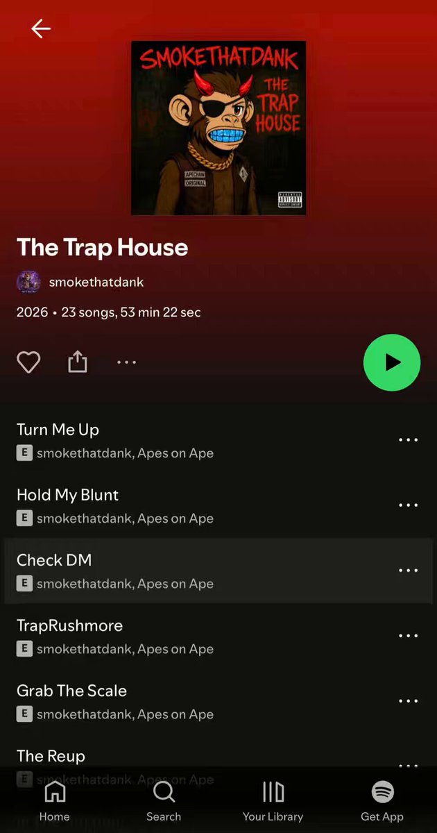 The image shows an album called "The Trap House" by a band, which was released on Spotify and other streaming platforms. It features a cartoon character wearing sunglasses and a hat as part of their music video. The album has been well-received by fans, with many people enjoying it. The post highlights the album's release date and encourages listeners to check out the album on various streaming platforms.