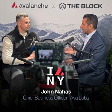 Two men in suits are seated in an interview setting on The Block podcast, branded with "avalanche × THE BLOCK" logos at the top and "I/NY John Nahas, Chief Business Officer, Ava Labs" text at the bottom, set against a mountainous backdrop as John Nahas discusses Avalanche's vision for the online-to-onchain movement.