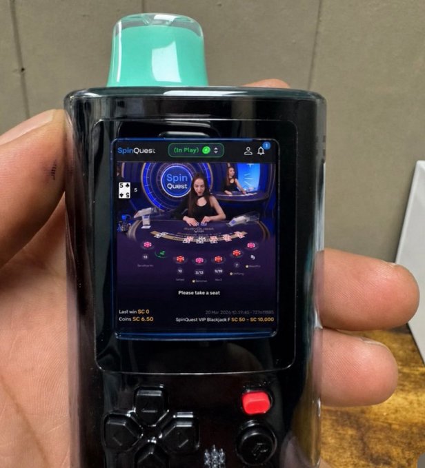 A hand holds a handheld gaming device displaying a live "SpinQuest" casino game with a dealer and betting interface, showing "5¢" and "$C 6.50" alongside "SpinQuest VIP Blackjack $C 50 - $C 10,000." The image humorously reframes traditional online gambling with live dealers as a question about who might build a similar mobile, live-streamed experience for memecoin trading.