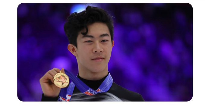 A young male figure skater of Asian descent holds up a gold medal, wearing a black competition jacket with a blue and white ribbon around his neck, set against a blurred purple arena backdrop.

Note: The caption accurately describes the image, but the accompanying post contains significant misinformation. The person pictured appears to be Nathan Chen, the American figure skater and Olympic gold medalist, but he is **not** a co-founder of Pi Network. Pi Network's founders are Nicolas Kokkalis, Chengdiao Fan, and Vincent McPhillip, and Nathan Chen has no known affiliation with any blockchain project or degrees from Rutgers or Harvard.