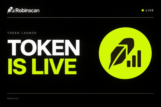 A promotional graphic from Robinscan announces "TOKEN LAUNCH" with bold white and neon green text reading "TOKEN IS LIVE," alongside a circular logo featuring a quill and rising bar chart, accompanied by a "LIVE" indicator in the top right corner, visually reinforcing the launch of the $SCAN token.