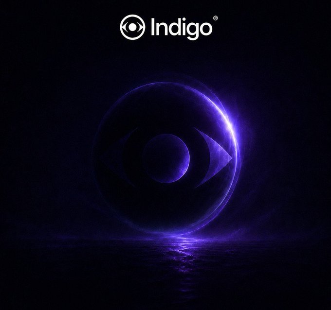 The Indigo logo featuring a glowing purple sphere over water at night.