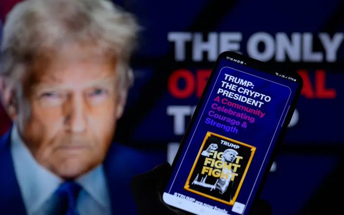 A cell phone displays information about the "$TRUMP" memecoin, featuring an image of Donald Trump. This visually connects to the news of significant investor losses on the memecoin.