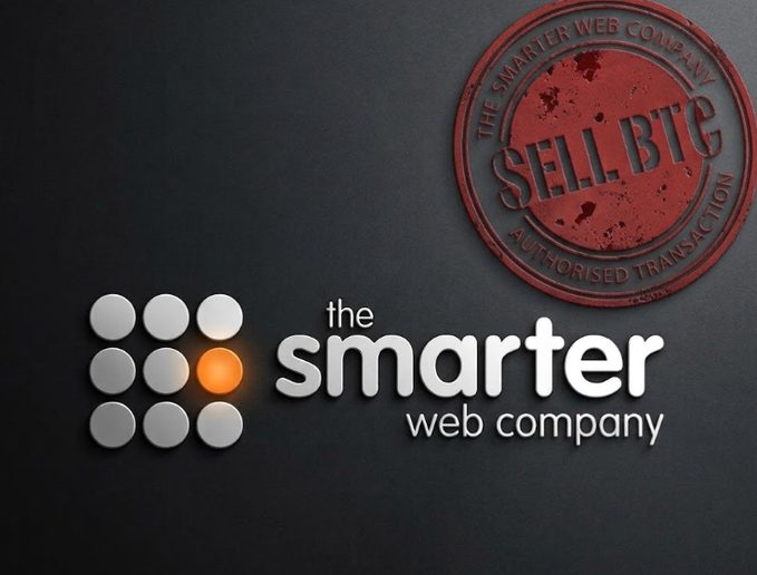The image features The Smarter Web Company logo alongside a red distressed stamp marked "SELL BTC - AUTHORISED TRANSACTION," visually reinforcing the accompanying post about the company selling 177.89 BTC to repay a $11.69M debt to TOBAM amid its deteriorating financial position.