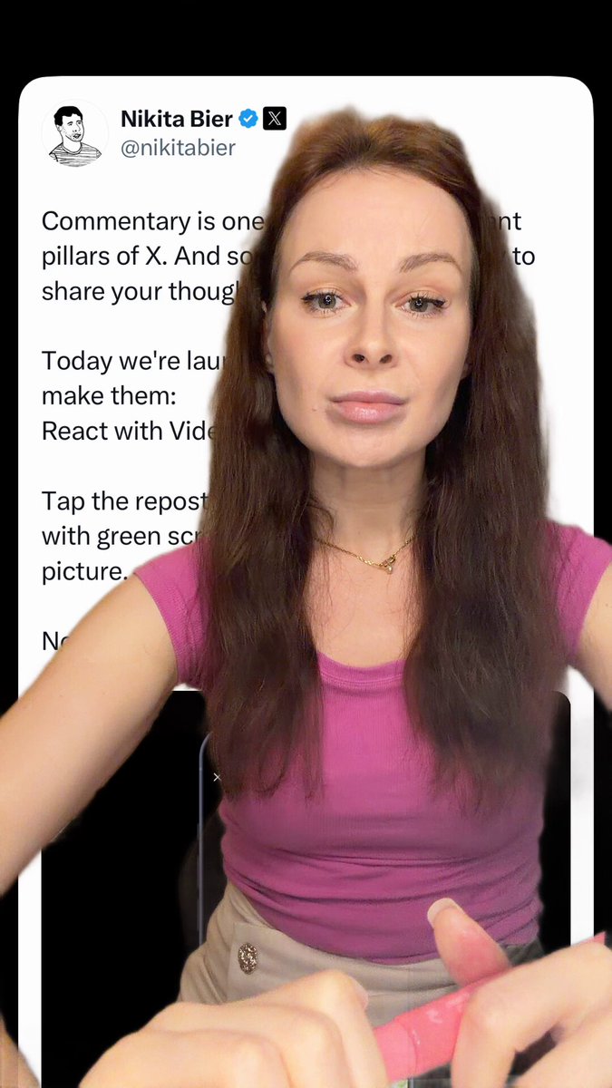 The image shows a woman with long brown hair, wearing a pink shirt, standing next to a computer screen displaying a message from someone named "Nikita Bilir" who has posted a picture of themselves. The text on the image includes phrases such as "comprehensive", "one pillars of X", and "Today we're gonna make them laugh".