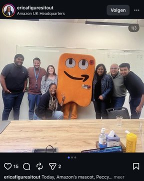 An Instagram post screenshot from 'ericafiguresitout' showing a group of people posing with Amazon's mascot, Peccy, a large orange box character, at Amazon UK Headquarters.