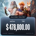 A digital prize notification displays a winning amount of $478,800.00 with Greek god figures visible at the top.