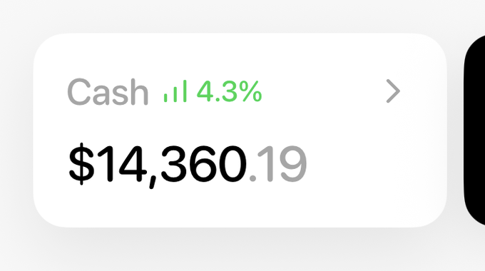 A mobile app interface displays a "Cash" account with a balance of $14,360.19, showing a small green upward trend arrow and a 4.3% return, illustrating the auto-earning cash feature described in the post.