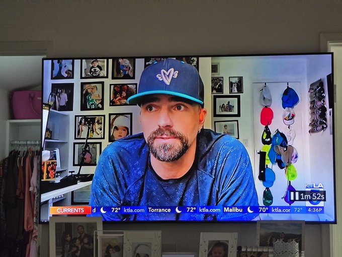 A television screen displaying a KTLA news broadcast featuring a man with a beard wearing a blue cap and athletic shirt, with weather information showing Torrance 72° and Malibu 72° in the ticker.