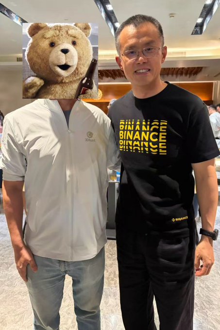 Binance founder CZ, wearing a black Binance-branded shirt, poses with a demo-day attendee in Bhutan. The post highlights CZ’s statements that stablecoins will cover all fiat currencies, asset pricing and FX will move on-chain, and AI will use crypto for trading before payments—ending with the advice to founders facing challenges: “Keep building @cz_binance.”