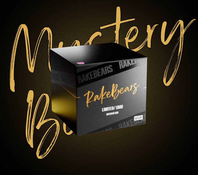 A 3D product render of a black and gold 'Rakebears Mystery Box' Limited to 1000 pieces, with gold brushstroke text in the background.