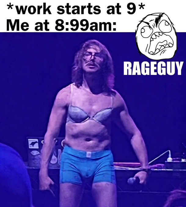 The image features a man wearing blue shorts, standing against a dark background with his arms crossed over his chest. The caption of the image reads "RAGEGUY knows this Always be at work before everyone else! FFFFFFFUUUUUUUU Spread the RAGE". This message is related to the post about the man in blue shorts and the time it was posted, as indicated by the caption's reference to a specific date.