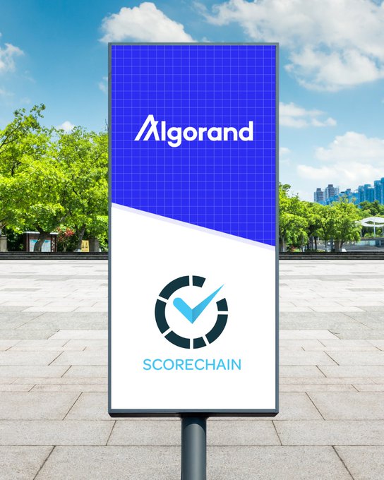 An outdoor billboard displays the Algorand logo at the top and the Scorechain logo with checkmark at the bottom, visually announcing Scorechain's new support for ALGO and Algorand Standard Assets as a blockchain analytics and compliance platform.