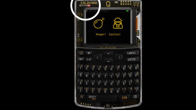A Coldcard hardware wallet displays "Danger!" and "Caution!" warnings on its screen, visually representing the signing ceremony attack surface highlighted in the text regarding $114M in losses.