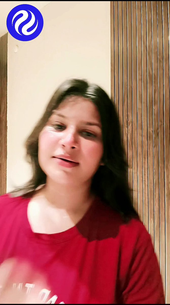 The image features a woman wearing a red shirt with her face partially visible as she looks at the camera, possibly posing for a photo or video. The background of the image consists of a wooden wall, which adds an interesting visual element to the scene. The caption provided in the image is related to the post about the future of finance and includes the words "DeFi" and "Coinbase", suggesting that the woman might be involved in or interested in these topics.