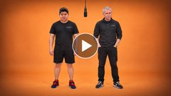 A video thumbnail showing two men standing against an orange background, with a play button overlay.