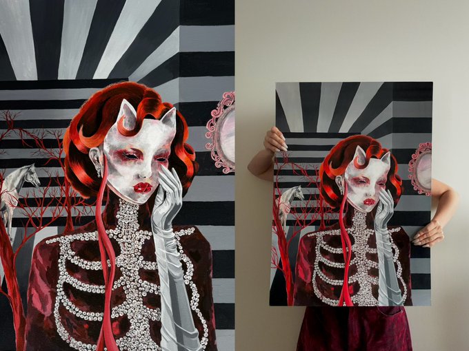 A split image showing a gothic painting of a red-haired demon-like woman with a jeweled skeletal bodice on the left, and a person holding the same painting on the right.