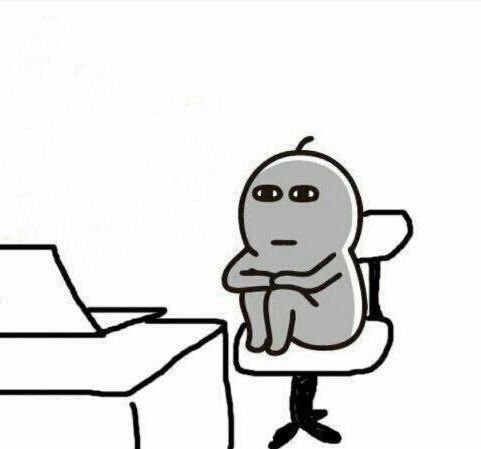 A simple black-and-white cartoon of a gray blob-like figure sitting at a desk with a laptop, looking unimpressed.