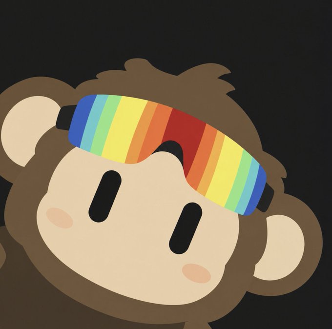 An illustration of a cute cartoon monkey character with a brown furry head, rosy cheeks, and black oval eyes wearing a rainbow-colored headband against a black background.