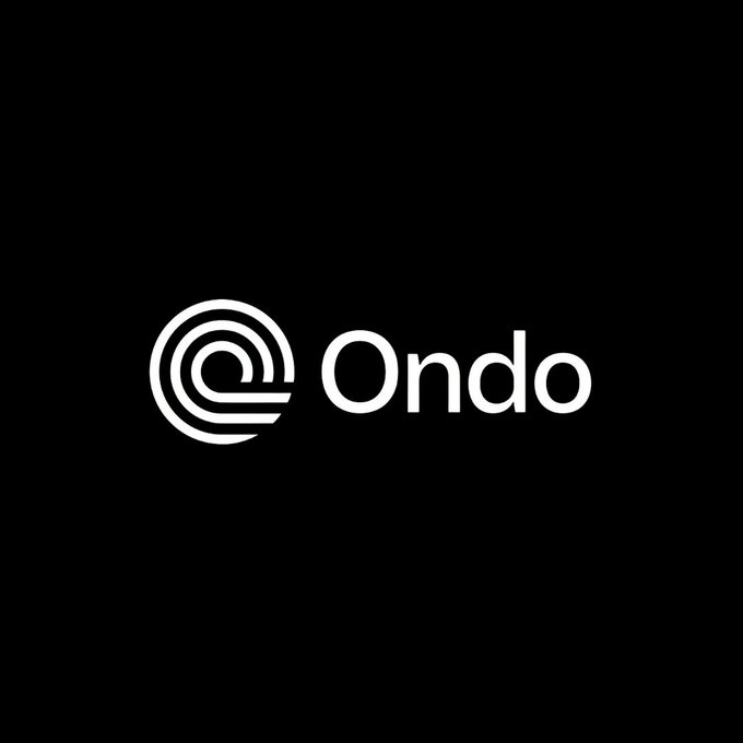 The image features a logo for an online financial services company called @OndoFinance. The logo consists of a white circle with a black outline, which is the main visual element of the design. The text "ONDO" is written in white letters below the circle, and it appears to be floating above the circle due to its position on top of it. The background of the image is black, making the white logo stand out prominently.