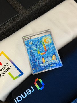 A cryptocurrency-themed card (Binance) featuring a Van Gogh Starry Night design, resting on fabric with the Renalytix logo visible.