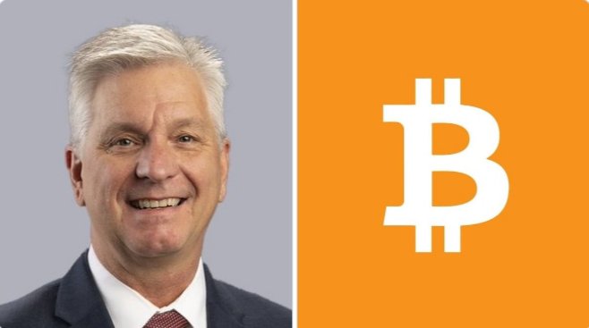The image shows FED Governor Christopher Waller smiling in a suit on the left side, paired with an orange panel featuring the white Bitcoin (₿) logo on the right. This visually represents the post's theme of Waller's comments dismissing crypto market concerns, where his portrait is juxtaposed with the Bitcoin symbol to emphasize his remarks about Bitcoin's price history and resilience through volatility.