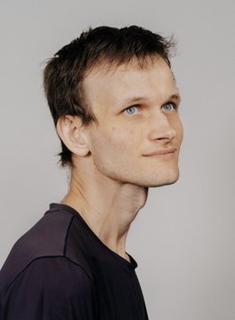 A young man with short brown hair, wearing a black t-shirt, looks off to the side with a slight smile against a plain background. The accompanying post humorously contrasts the wealth of Vitalik Buterin, the Ethereum creator, with that of Justin Sun, who purchased the famous banana artwork, highlighting the unpredictability of value in crypto and art.
