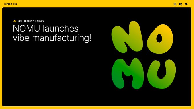 A webpage announcement with a yellow border displays the text "NOMU launches vibe manufacturing!" alongside a stylized green and yellow "NOMU" logo on a black background.