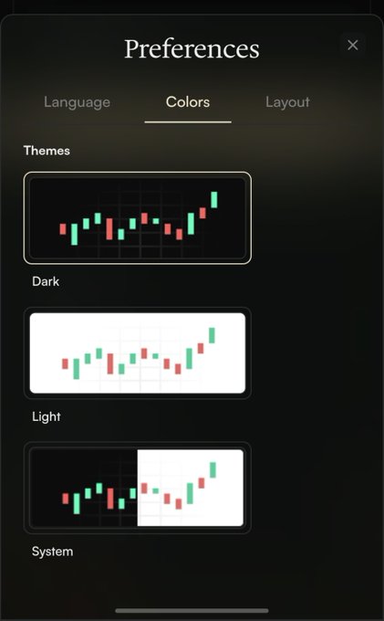 The image shows a "Preferences" menu from the Arcus trading app, specifically the "Colors" tab where users can select between Dark, Light, and System themes for their candlestick charts. The screenshot illustrates the Dark mode option being highlighted, directly supporting the post's tip about switching to dark mode via Preferences → Colors → Dark for a cleaner trading interface with 24/7 stock tokens and 0% fees on Arcus.