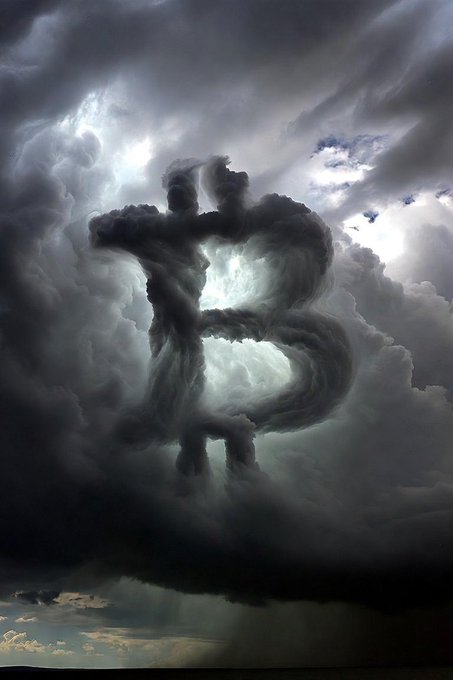 The image shows a dramatic stormy sky where dark clouds form the shape of the Bitcoin "₿" symbol, with rays of light breaking through. This visual aligns perfectly with the "Plan ₿" caption, symbolizing the cryptocurrency Bitcoin emerging powerfully from turbulent conditions.