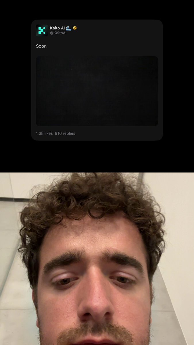 The image shows a man with curly hair wearing glasses, looking at his phone screen. There are two posts displayed side by side - one showing a photo of the man's face, and another showing a message from Kaito. The man appears to be engaged in a conversation or browsing social media on his phone.