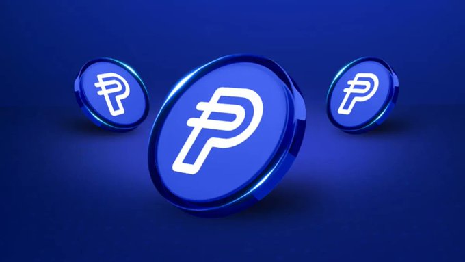 Three blue 3D-rendered crypto coins featuring the white 'P' logo of PayPal's PYUSD stablecoin, displayed against a dark blue background with a large coin in the center and two smaller ones in the background.
